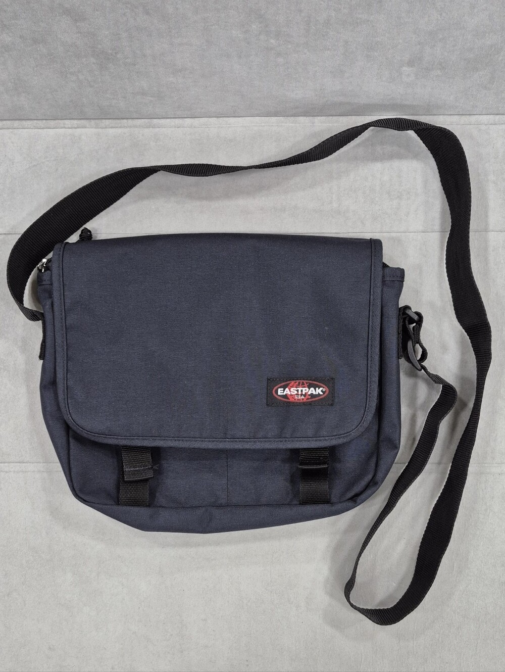 EastPak small messenger bag navy blue canvas laptop padded sleeve weatherproof